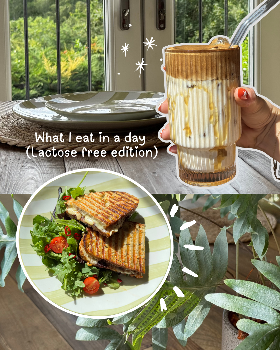 A hand holding a layered drink next to a plate and a bowl of grilled sandwiches on a table with greenery in the background.