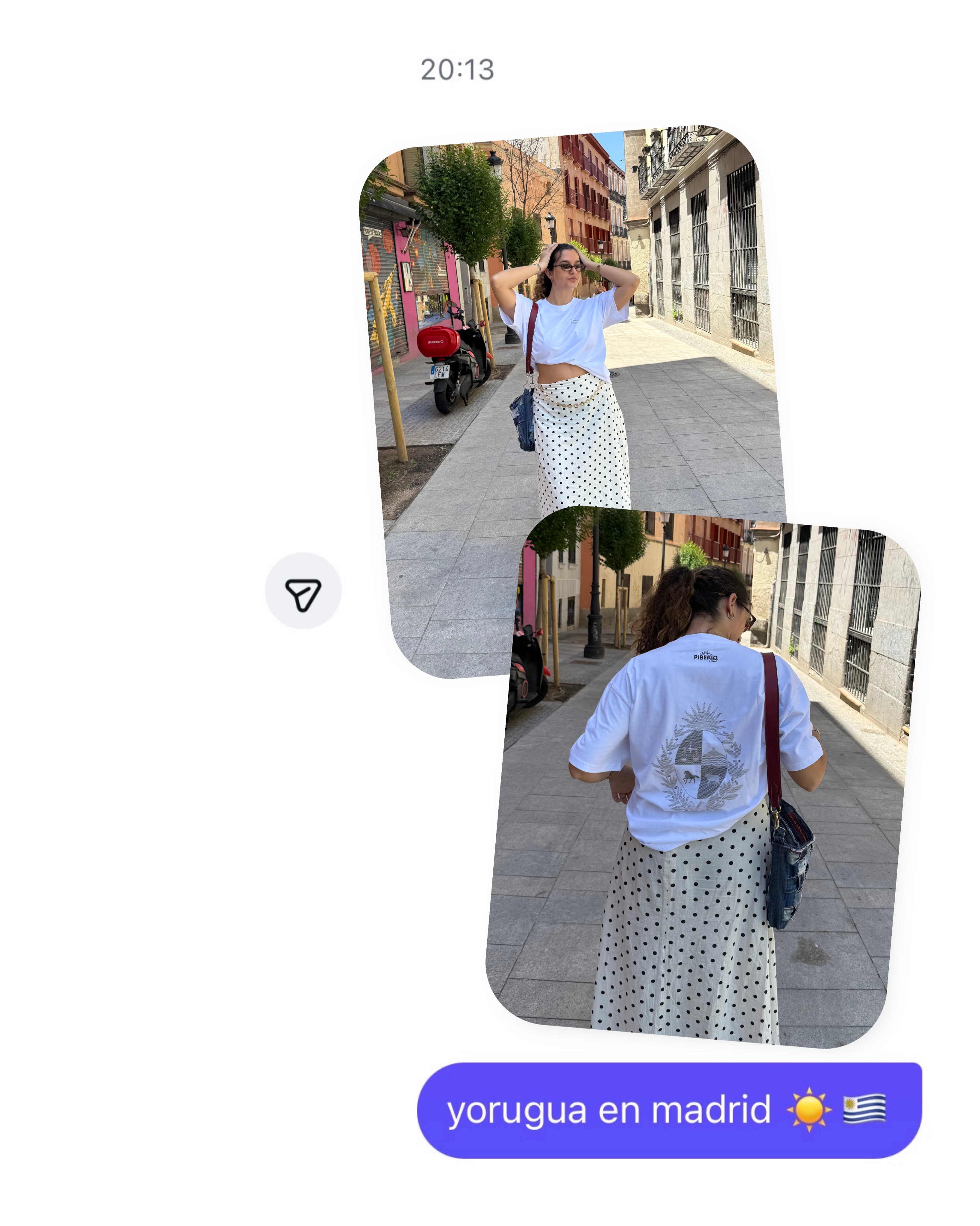A person wearing a white t-shirt and a patterned skirt poses on a street in Madrid, showcasing a casual and stylish outfit.